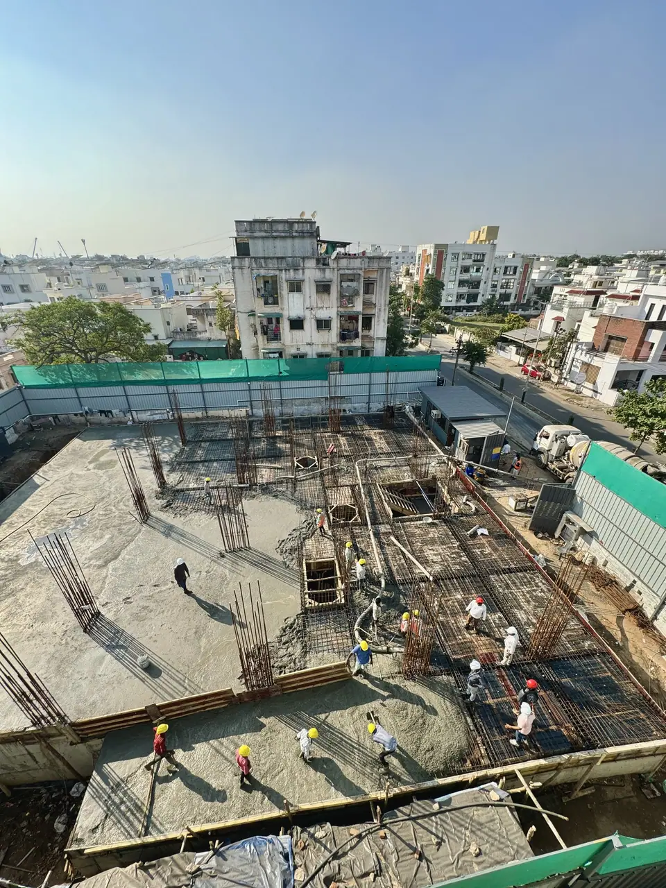 Slab reinforcement being laid across a floor at Shreeji Avenue, seen from above